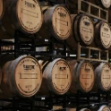 brown wooden barrels on rack