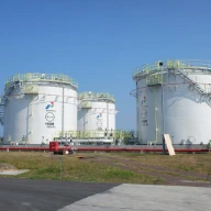 two large white tanks sitting next to each other
